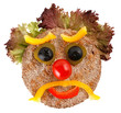 unhappy face made of vegetables and bread