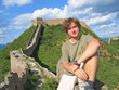 a trekker man having some rest on the great wall of china, china