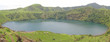 blue lake with green grass around, cameroon, africa, panorama