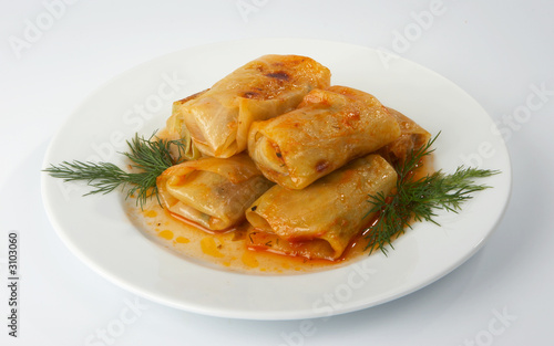 meat stuffed cabbage leaves, stewed in tomato sauce.