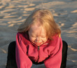 cute little girl playing on beach