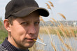 the rough sexual unshaven macho with a cigarette