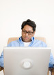 asian man with laptop