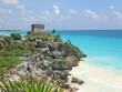 tropical carabian beach with a maya temple of a top of a rock cl