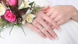 female hands held together showing off rings and f