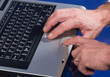 man using a notebook's touchpad