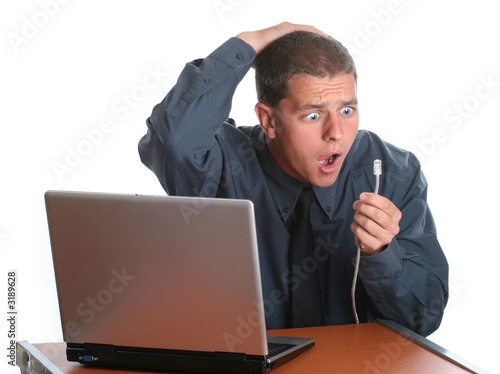 Photo: male in office getting unplugged male in office getting unplugged