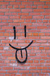brick wall and smile graffiti