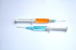 orange and blue syringes