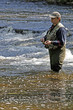 fisher in river
