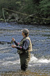 fisher in river