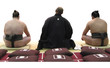 sumo wrestlers sitting