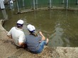 couple sitting with their feet in jordan river