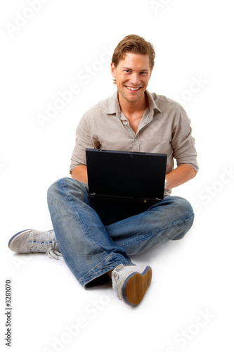 young man sitting with laptop
