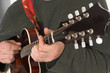 close up of man playing guitare close up of man playing guitare