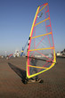 man windskating on street by seafront