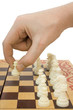 pawn in hand and chessboard