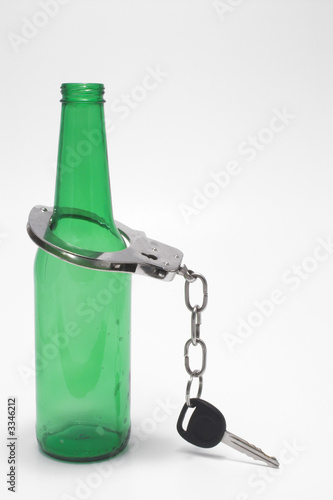 Photo: beer, keys and handcuffs - drunk driving concept beer, keys and handcuffs - drunk driving concept