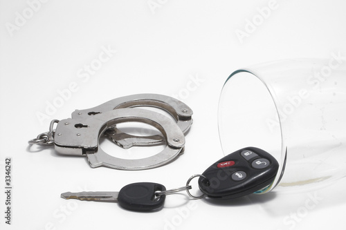 Photo: beer, keys and handcuffs - drunk driving concept beer, keys and handcuffs - drunk driving concept