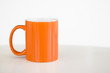 orange mug with white background