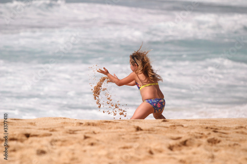 child on beach enjoying life