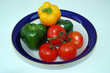 a bowl of peppers and tomatoes