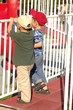 boys looking through railing