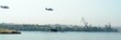 military planes fly by above a submarine