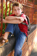 Photo: boy with schoolbag slung over shoulder boy with schoolbag slung over shoulder