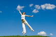 jumping girl in meadow