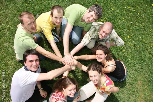 Eight friends have combined hands together