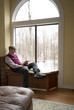 reading book at suburban house