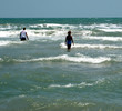 people going into the water