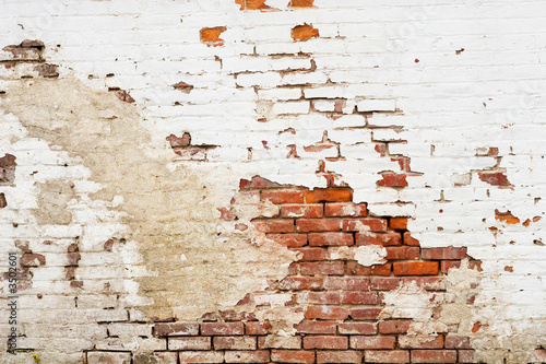 Photo: old weathered brick wall old weathered brick wall