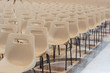Row of empty chairs waiting to be occupied