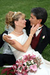 Bridal Couple Sitting On Grass