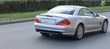 luxury car from behind, back view in motion luxury car from behind, back view in motion