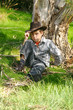 A boy in rugged bushland in the outback ranges of Australia