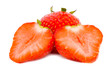 Slices of a strawberry on a white background.