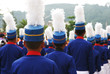 Group of marching boys in blue and white uniforms Group of marching boys in blue and white uniforms