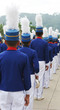 Marching band members in blue and white uniforms Marching band members in blue and white uniforms