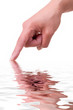 Hand of a woman with water reflection over white background Hand of a woman with water reflection over white background
