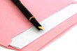 Pink envelope and pen isolated on white