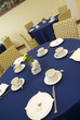 Blue and yellow table before wedding in restaurant