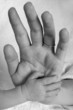newborn baby and mother's hand