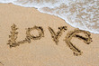 I love you written in the sandy beach. I love you written in the sandy beach.