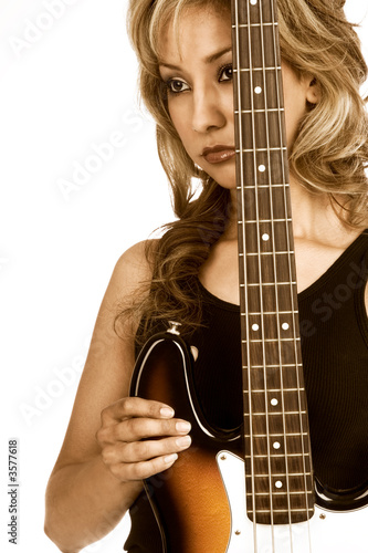 Photo: Portrait of Attractive Girl with electric bass guitar Portrait of Attractive Girl with electric bass guitar