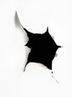 A hole torn in a peice of paper A hole torn in a peice of paper