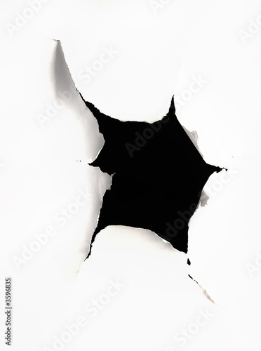 A hole torn in a peice of paper
