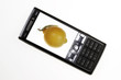 Mobile phone with lemon on screen